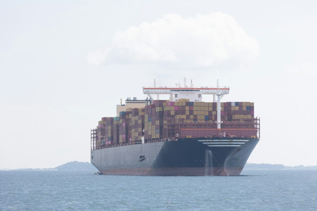 A cargo ship travels across the ocean.
